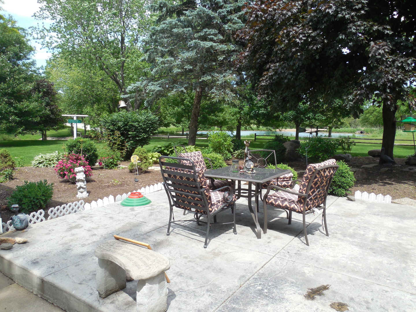 12340 West Offner Road Manhattan, IL 60442 - Photo 29 of 38 a view of a chairs and table in backyard