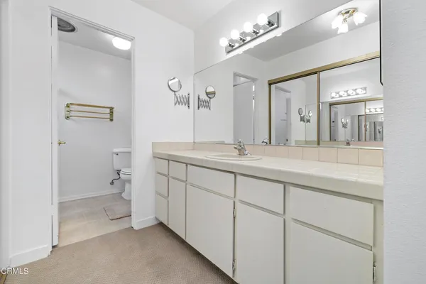 a bathroom with a glass shower door