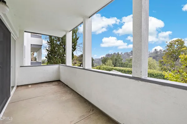 a view of a chairs and table in the garden