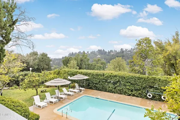 a view of swimming pool from a balcony