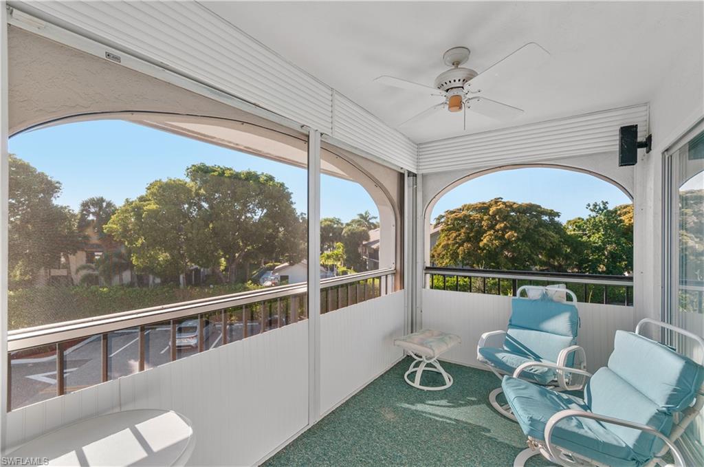 5 High Point Circle West, Unit 301 Naples, FL 34103 - Photo 1 of 37 a view of a porch with furniture