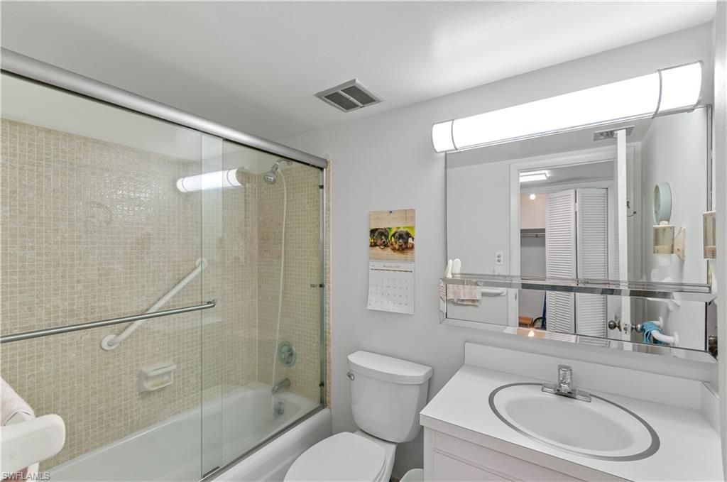 5 High Point Circle West, Unit 301 Naples, FL 34103 - Photo 18 of 37 a bathroom with a sink toilet and shower