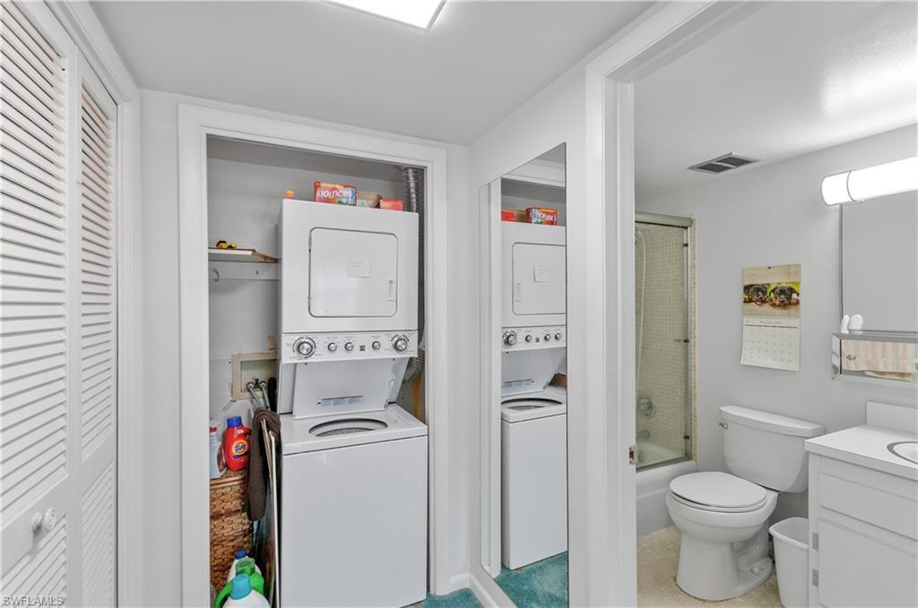 5 High Point Circle West, Unit 301 Naples, FL 34103 - Photo 19 of 37 a bathroom with a toilet and a shower