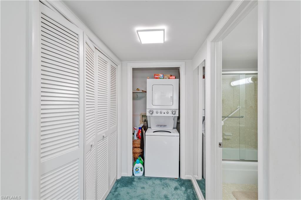 5 High Point Circle West, Unit 301 Naples, FL 34103 - Photo 20 of 37 a view of hallway and closet