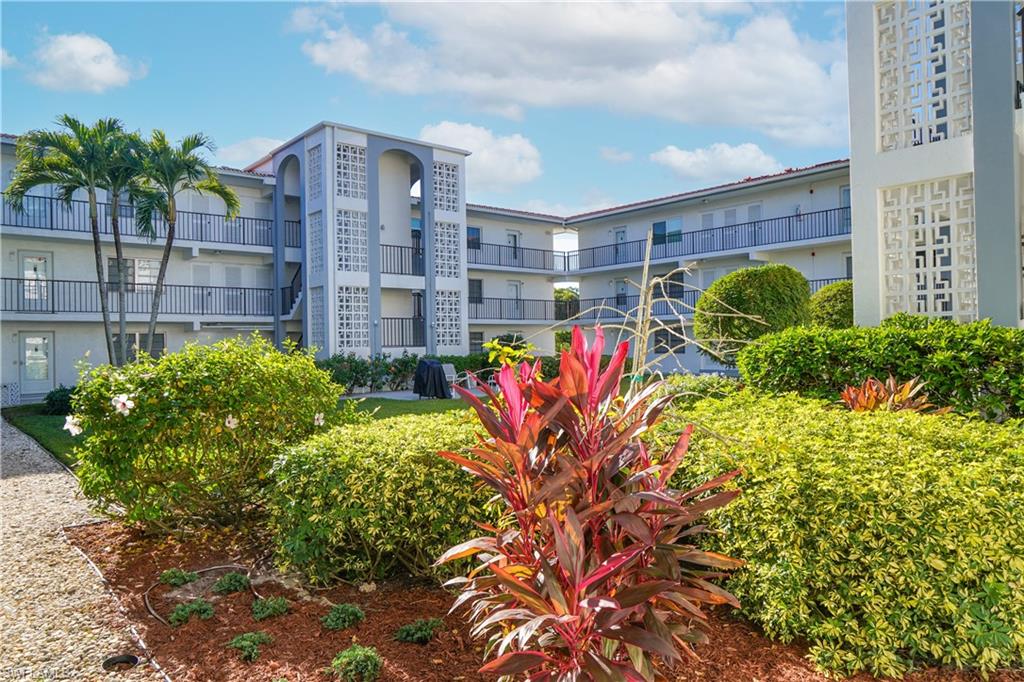 5 High Point Circle West, Unit 301 Naples, FL 34103 - Photo 24 of 37 a view of a bunch of plants