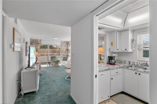 a view of a kitchen with appliances and cabinets
