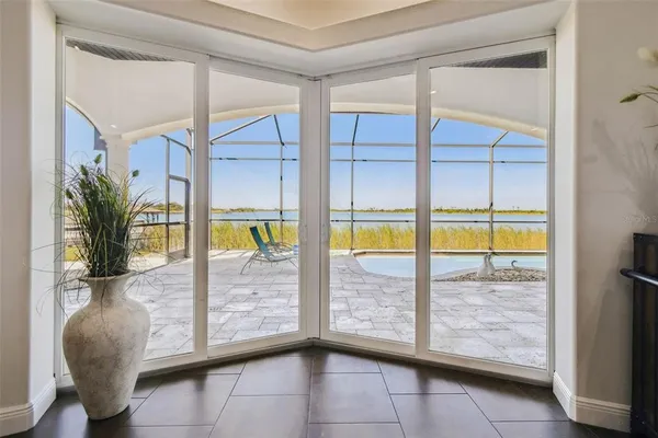 a view of a workspace with furniture and wooden floor