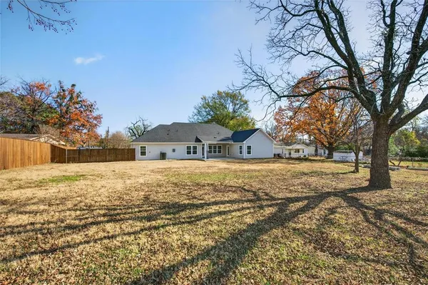 a house view with large trees