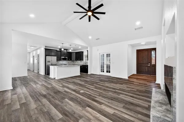 a view of a kitchen with sink and cabinet