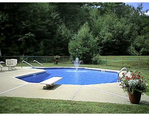 450 Sterling Road Holden, MA 01522 - Photo 3 of 6 a view of a backyard with table and chairs potted plants and swimming pool