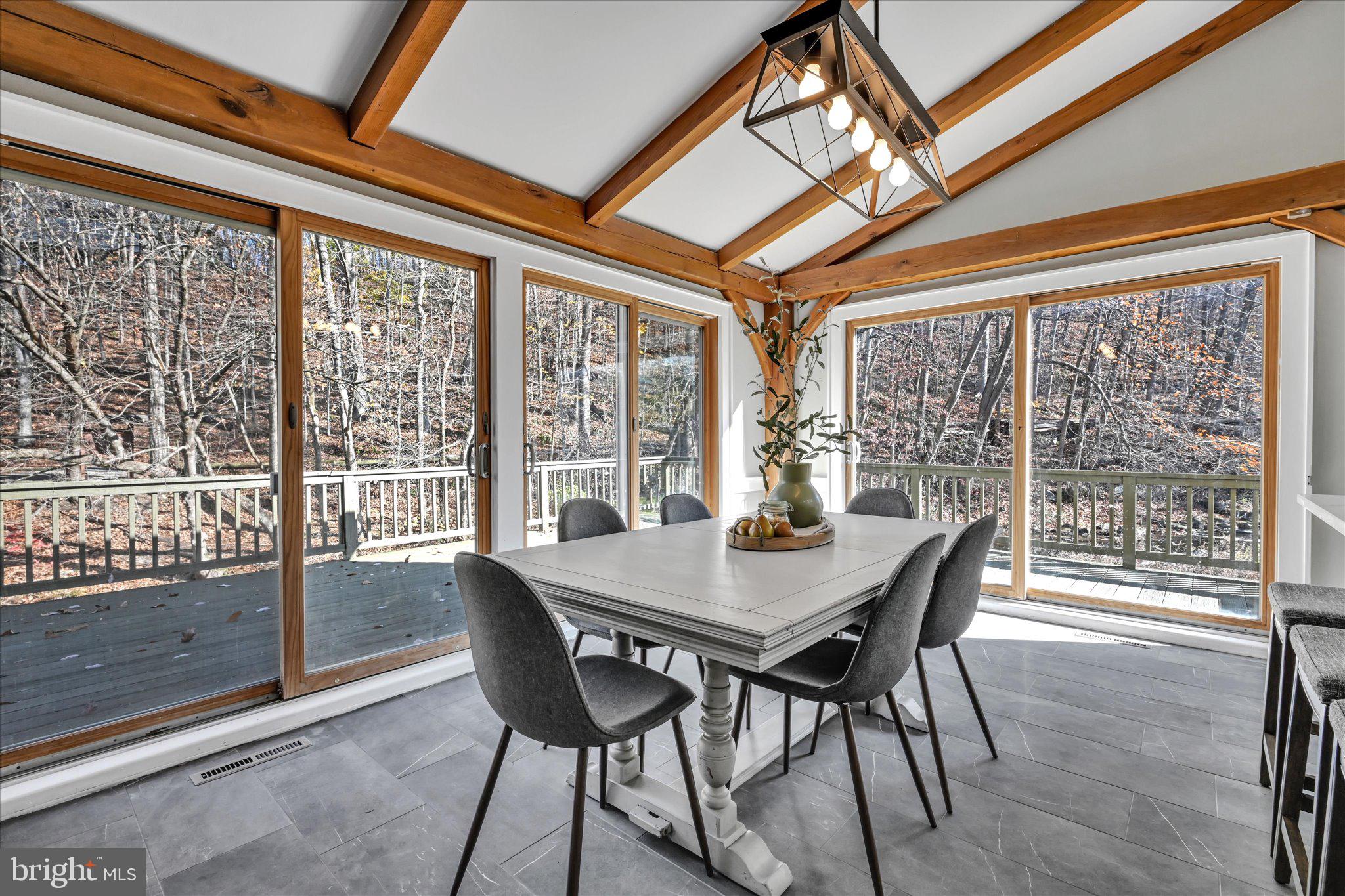 102 Landenberg Road Landenberg, PA 19350 - Photo 19 of 62 a view of a dining room with furniture large windows and wooden floor