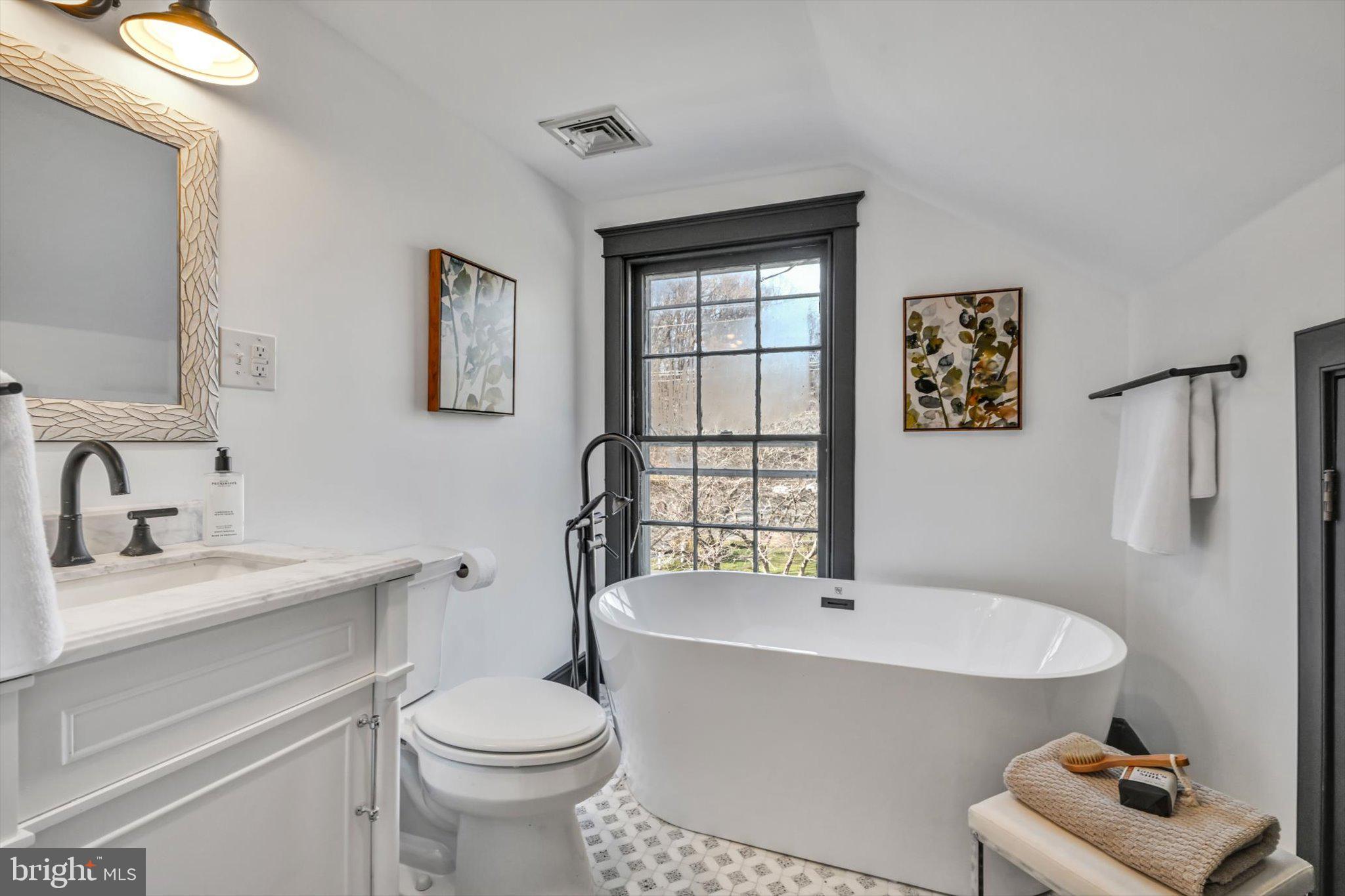 102 Landenberg Road Landenberg, PA 19350 - Photo 42 of 62 a bathroom with a sink a toilet and a mirror
