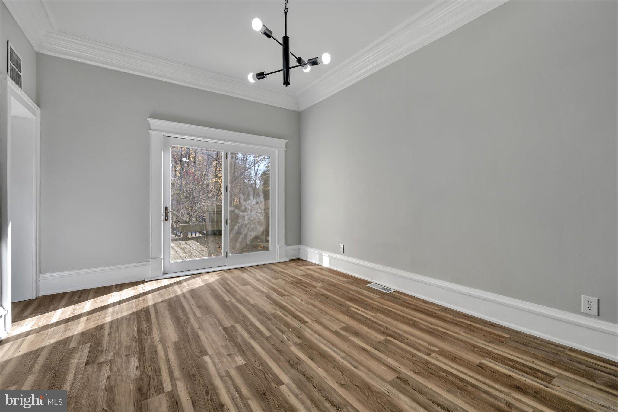 102 Landenberg Road Landenberg, PA 19350 - Photo 46 of 62 a view of an empty room with wooden floor and a window