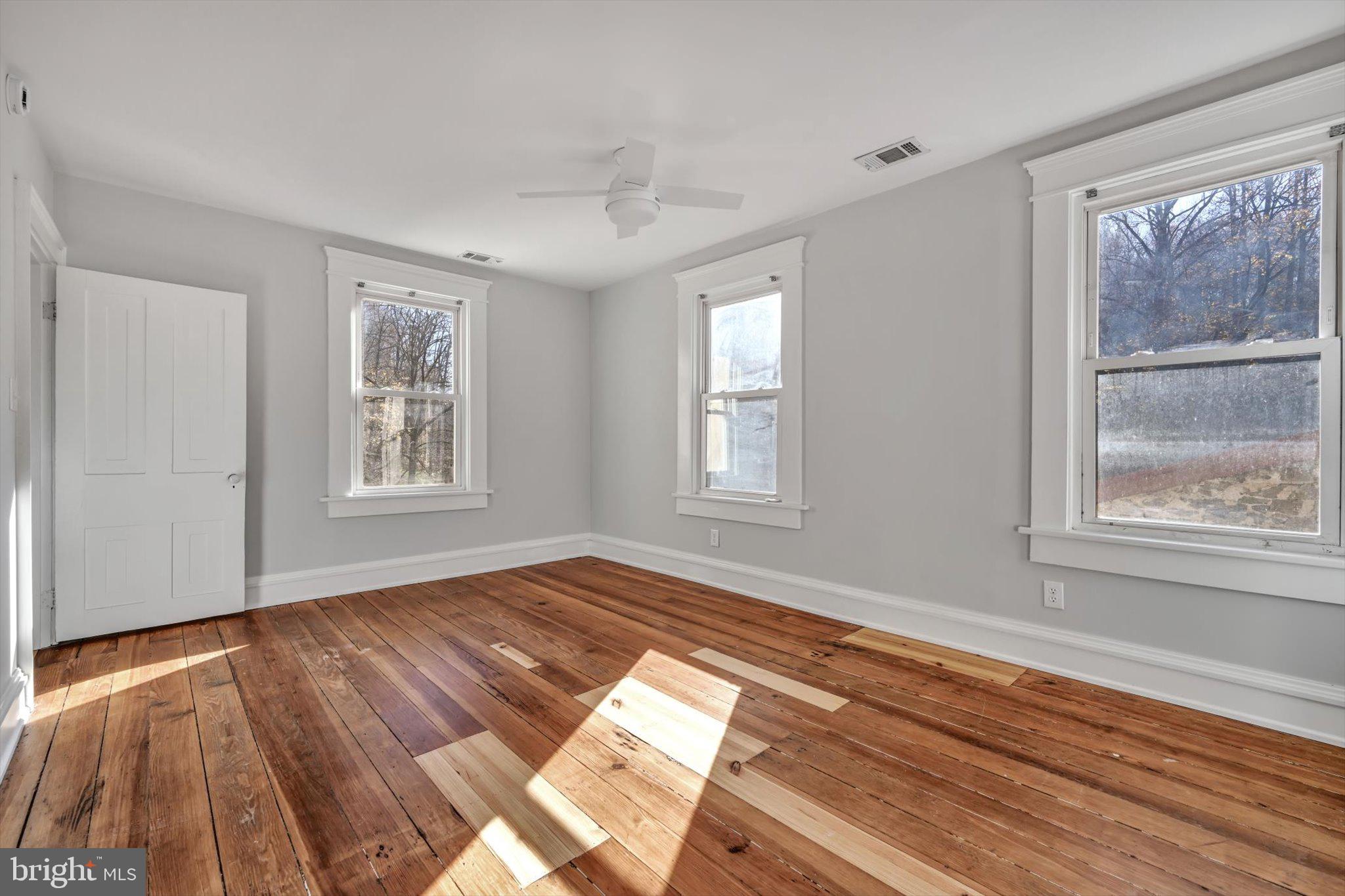 102 Landenberg Road Landenberg, PA 19350 - Photo 51 of 62 a view of empty room with wooden floor and fan