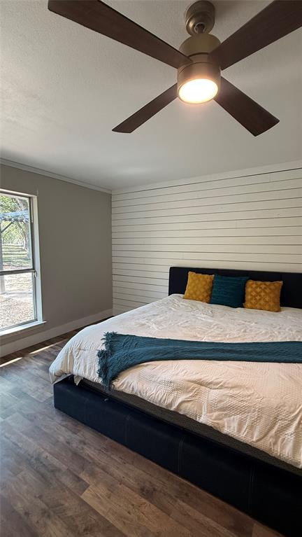 8513 Ravenswood Road Granbury, TX 76049 - Photo 14 of 21 Recessed lighting, wood-finish flooring, shiplap wall and a ceiling fan with integrated lighting