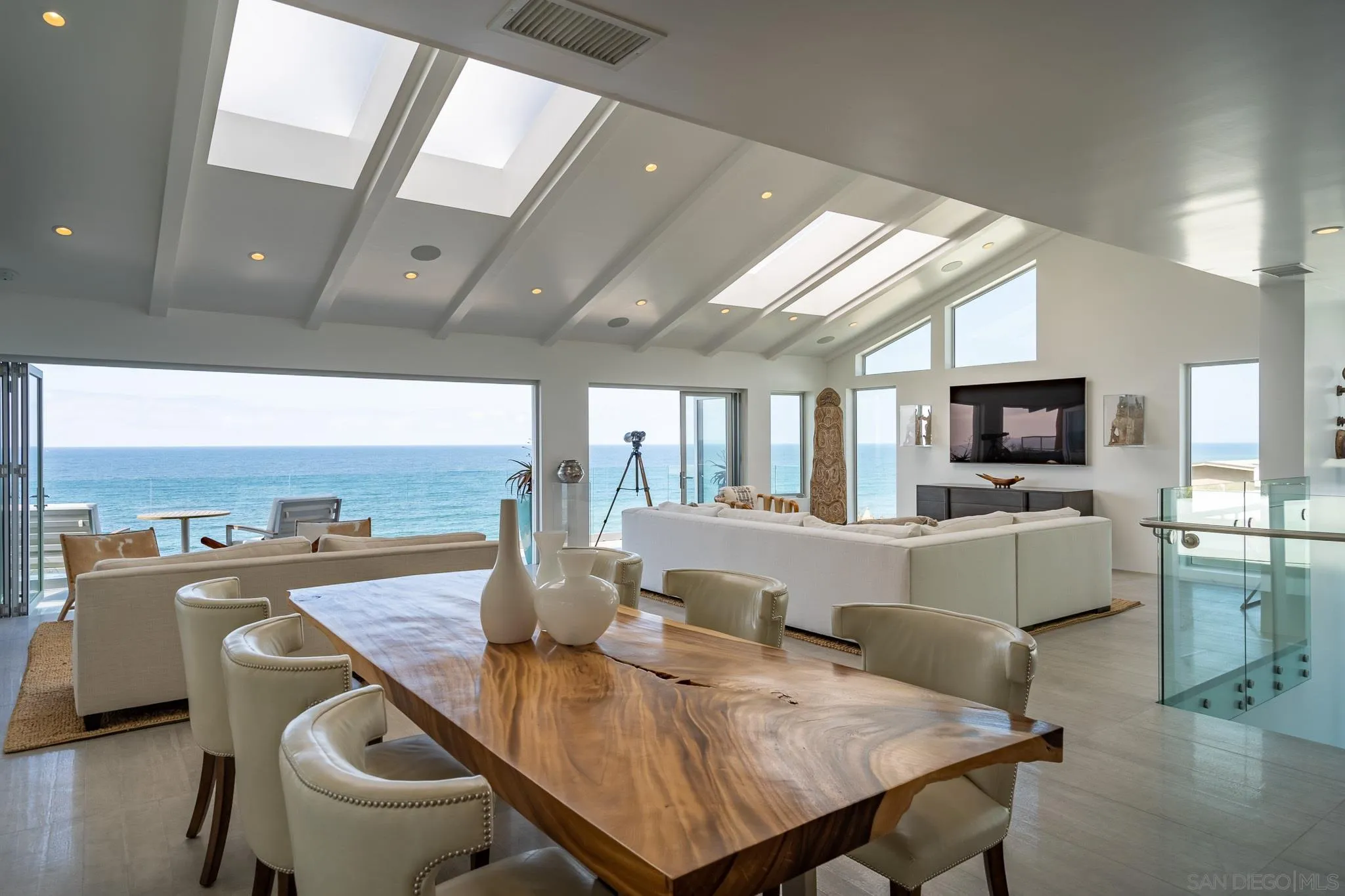 700 Neptune Avenue Encinitas, CA 92024 - Photo 2 of 36 a view of a dining room with furniture window and wooden floor