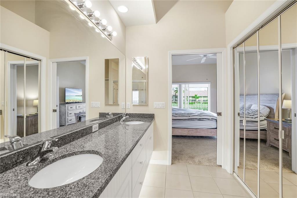 2395 Bayou Lane, Unit 7304 Naples, FL 34112 - Photo 16 of 27 MASTER BATH WITH DUAL SINKS and spacious walk-in closet