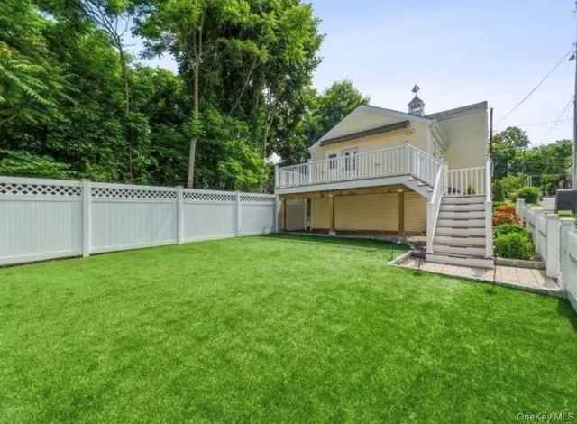 a view of an house with backyard space and garden