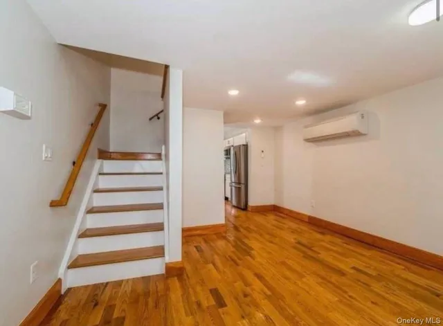 a view of entryway with wooden floor