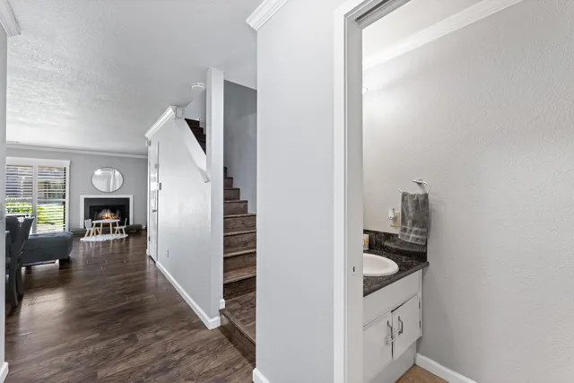 a kitchen with sink and cabinets