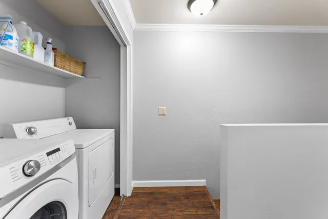 a view of storage and utility room with washer and dryer