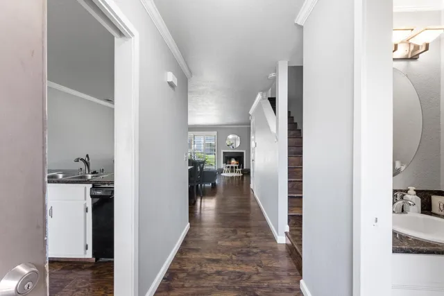a view of a living room with a wooden floor