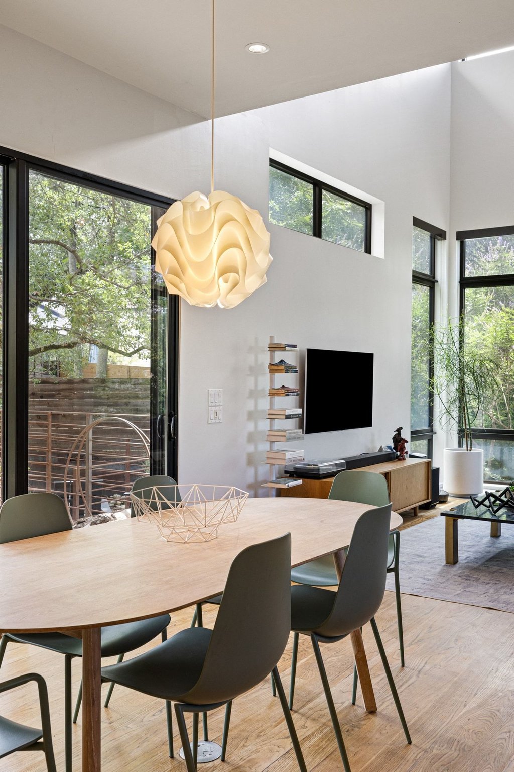 801 The High Road Austin, TX 78746 - Photo 16 of 40 a outdoor dining space with furniture and window