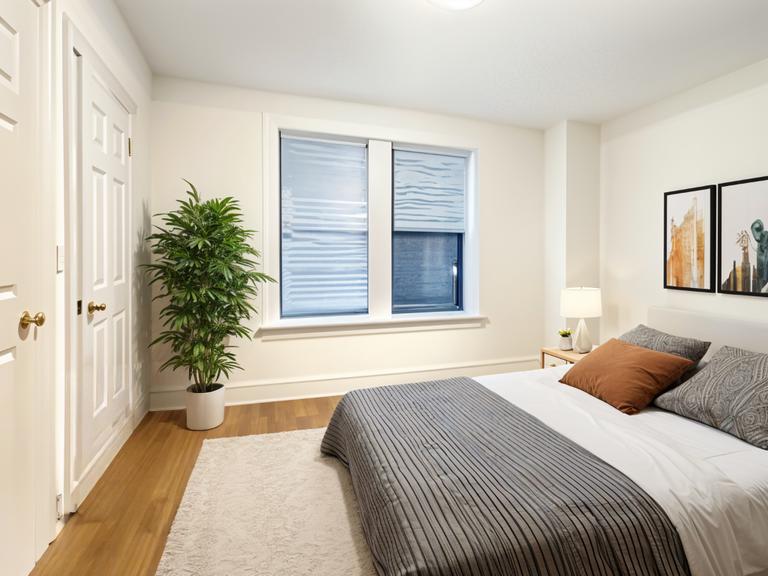 425 Riverside Drive, Unit 6D Manhattan, NY 10025 - Photo 4 of 14 a bedroom with a bed and a window