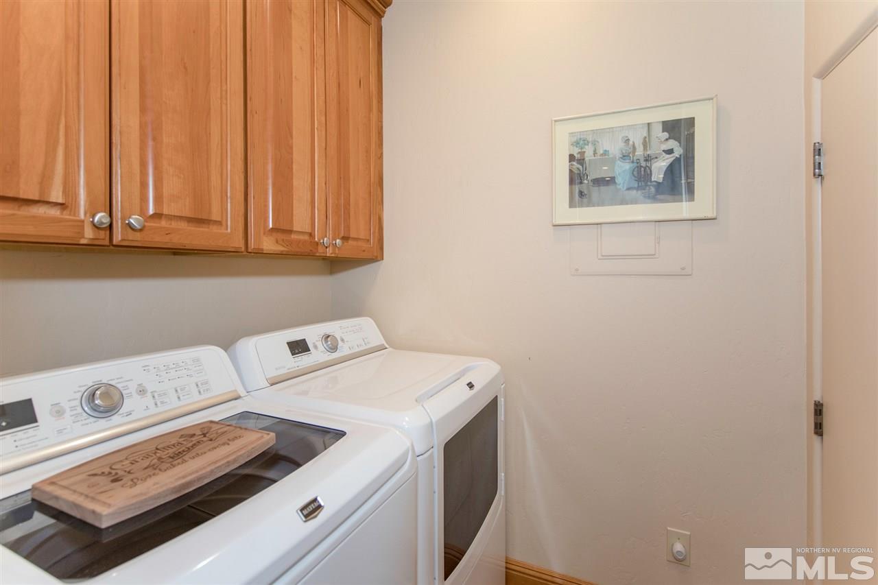 6365 Wetzel Court, Unit MONTRUEX 3 Reno, NV 89511 - Photo 18 of 24 a utility room with dryer and washer