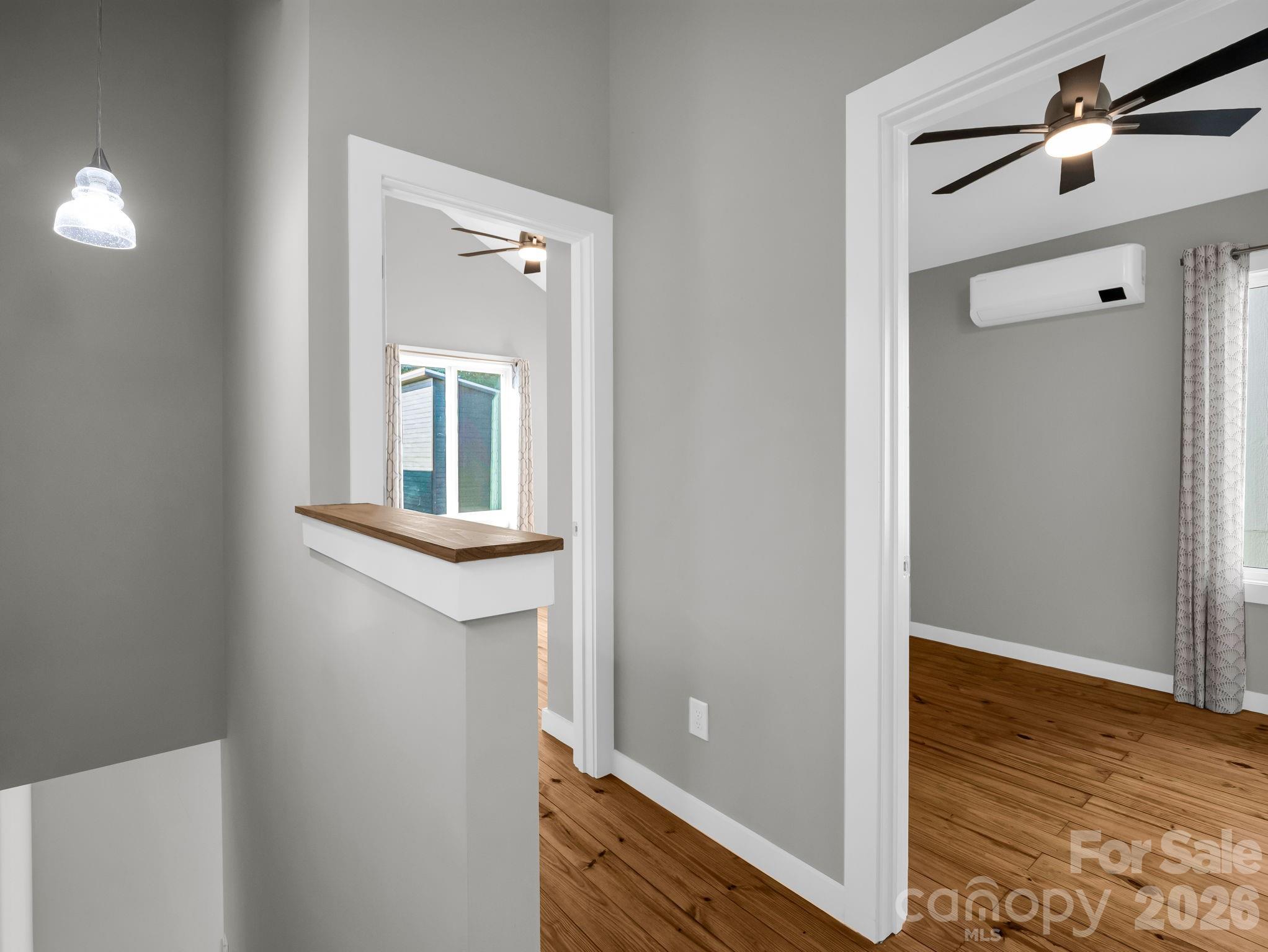 9 East Citra Street Arden, NC 28704 - Photo 16 of 28 a view of a hallway with wooden floor and closet