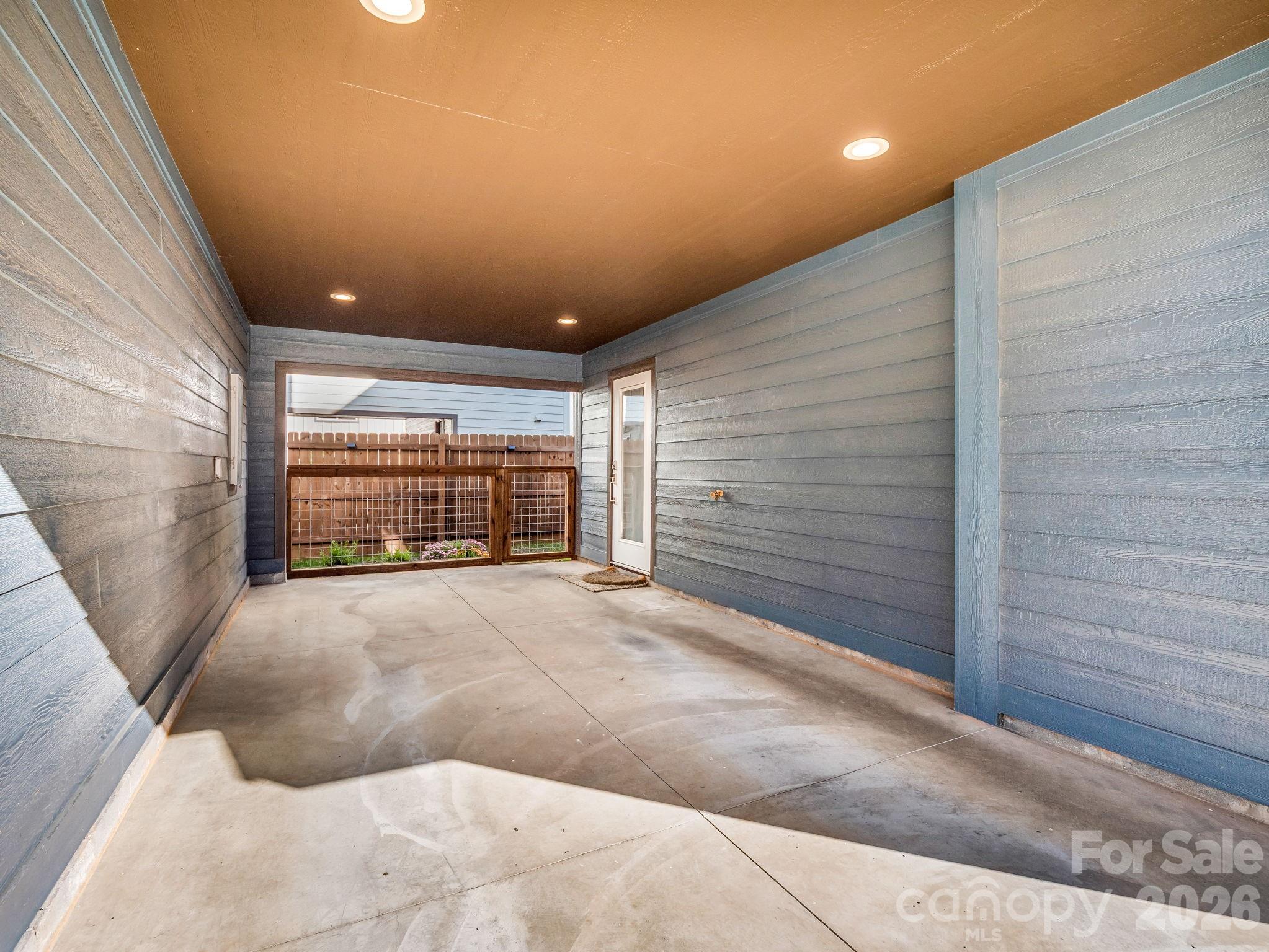 9 East Citra Street Arden, NC 28704 - Photo 19 of 28 a view of large parking space wooden building and windows