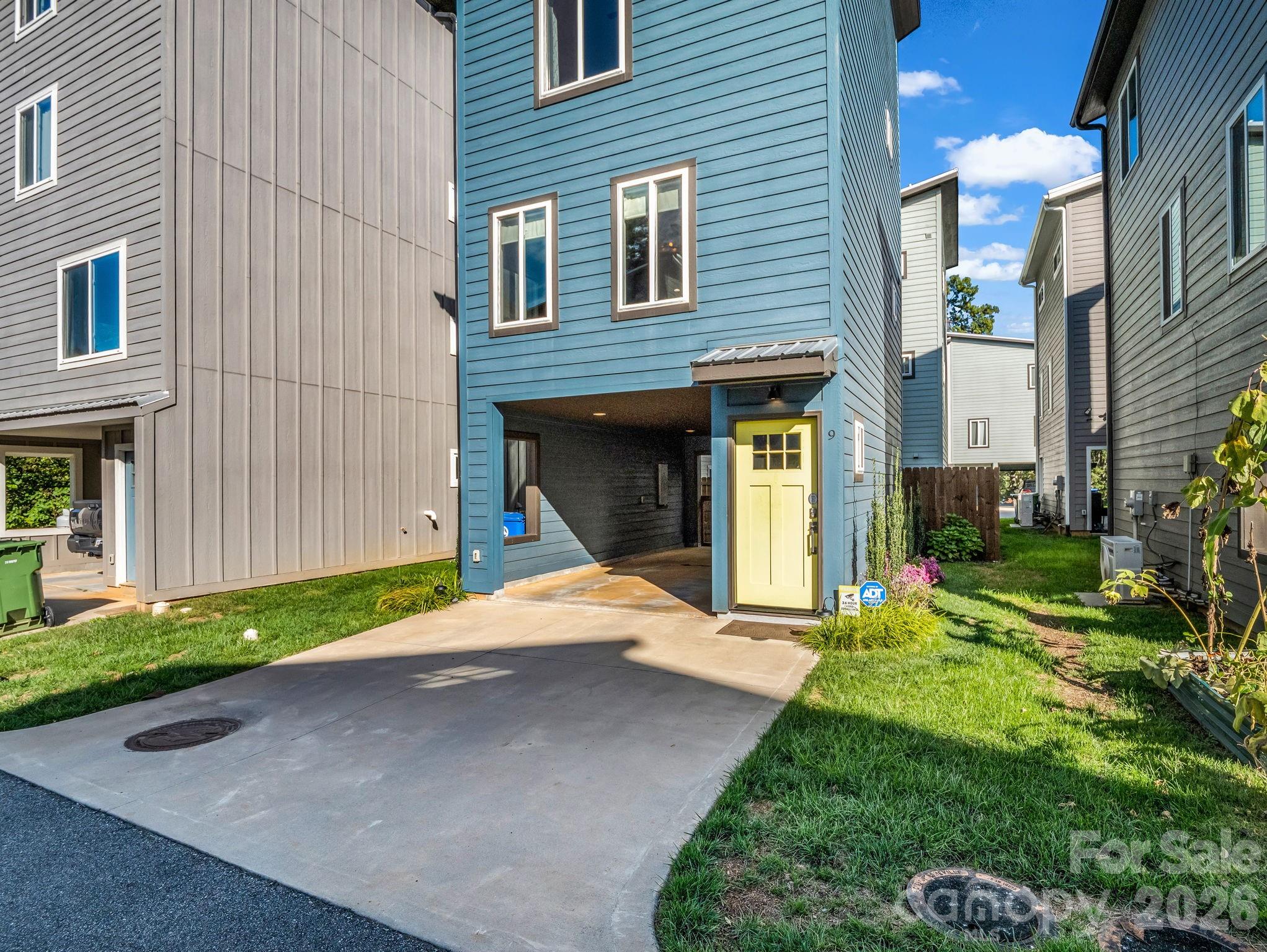 9 East Citra Street Arden, NC 28704 - Photo 2 of 28 a view of a house with a yard and garage
