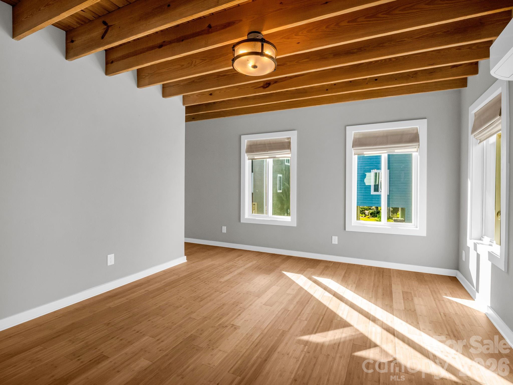 9 East Citra Street Arden, NC 28704 - Photo 5 of 28 a view of a room with wooden floor and windows