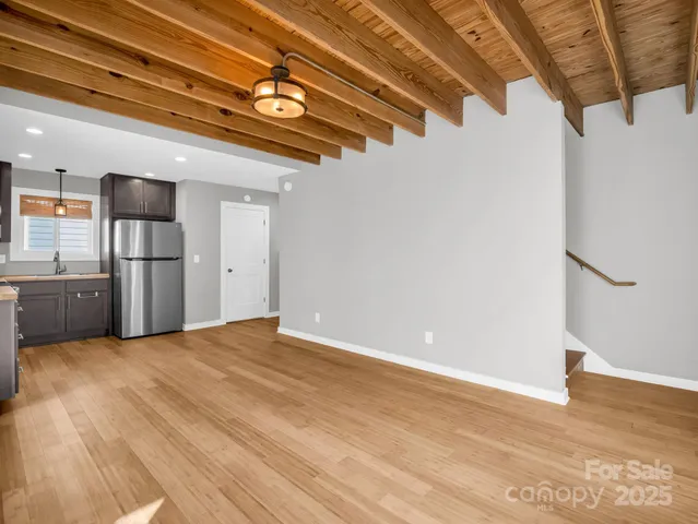 a view of a room with a refrigerator