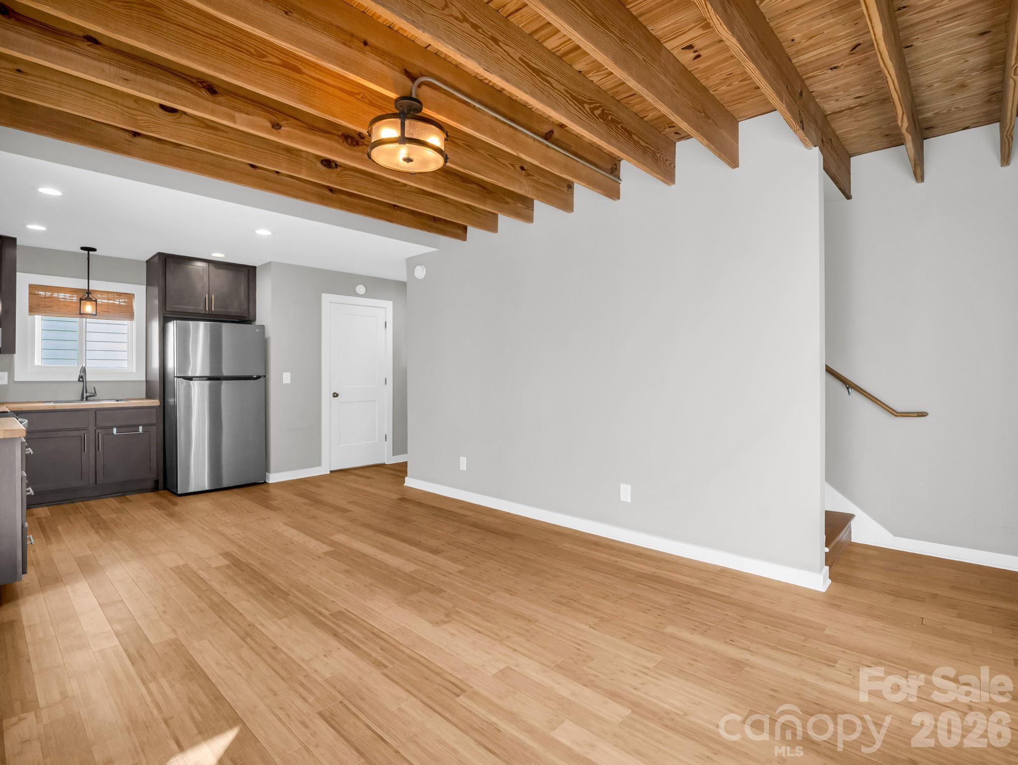 9 East Citra Street Arden, NC 28704 - Photo 8 of 28 a view of a room with a refrigerator