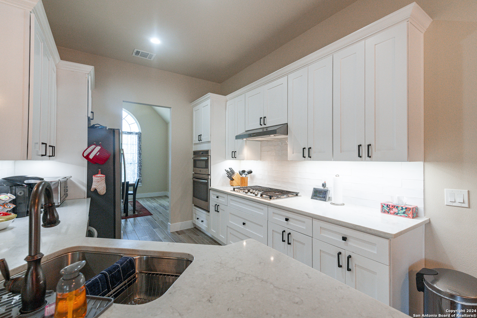 924 Rhinestone Canyon Lake, TX 78133 - Photo 11 of 41 a kitchen that has a lot of cabinets a sink and appliances