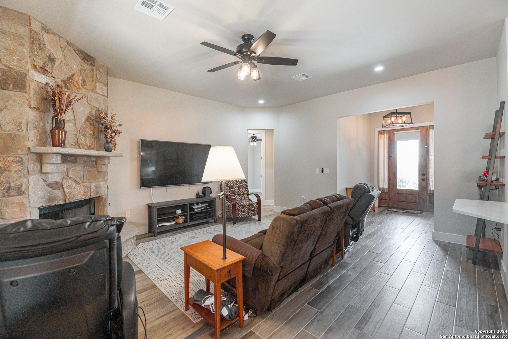 924 Rhinestone Canyon Lake, TX 78133 - Photo 14 of 41 a living room with furniture and a flat screen tv