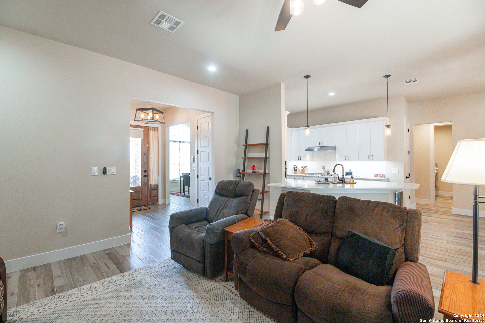 924 Rhinestone Canyon Lake, TX 78133 - Photo 16 of 41 a living room with furniture and kitchen view