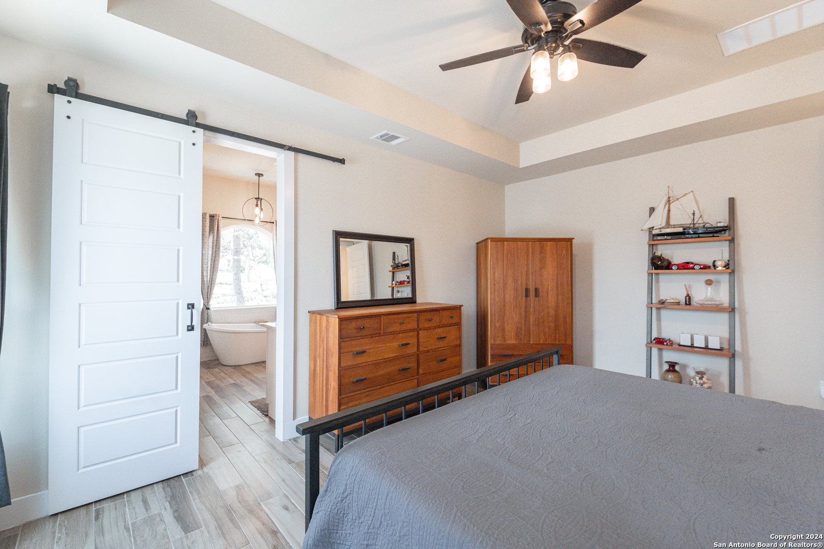 924 Rhinestone Canyon Lake, TX 78133 - Photo 18 of 41 a bedroom with furniture and window