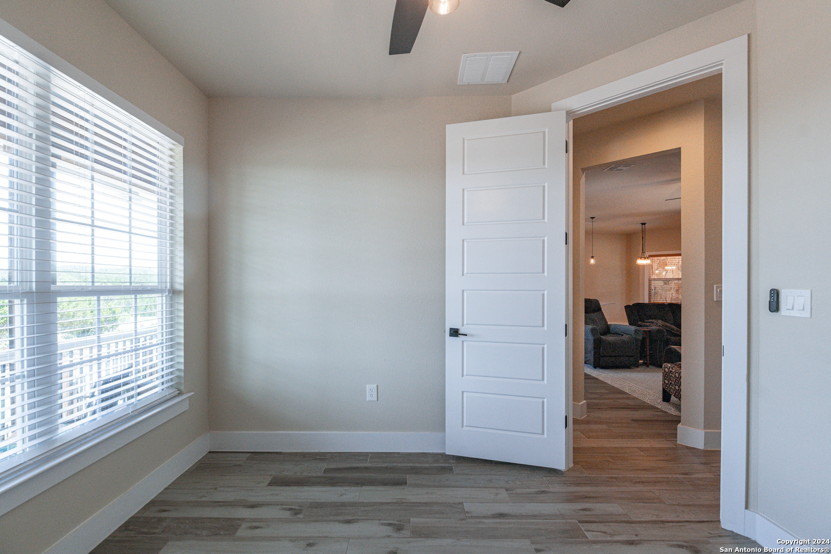 924 Rhinestone Canyon Lake, TX 78133 - Photo 22 of 41 a view of empty room with wooden floor