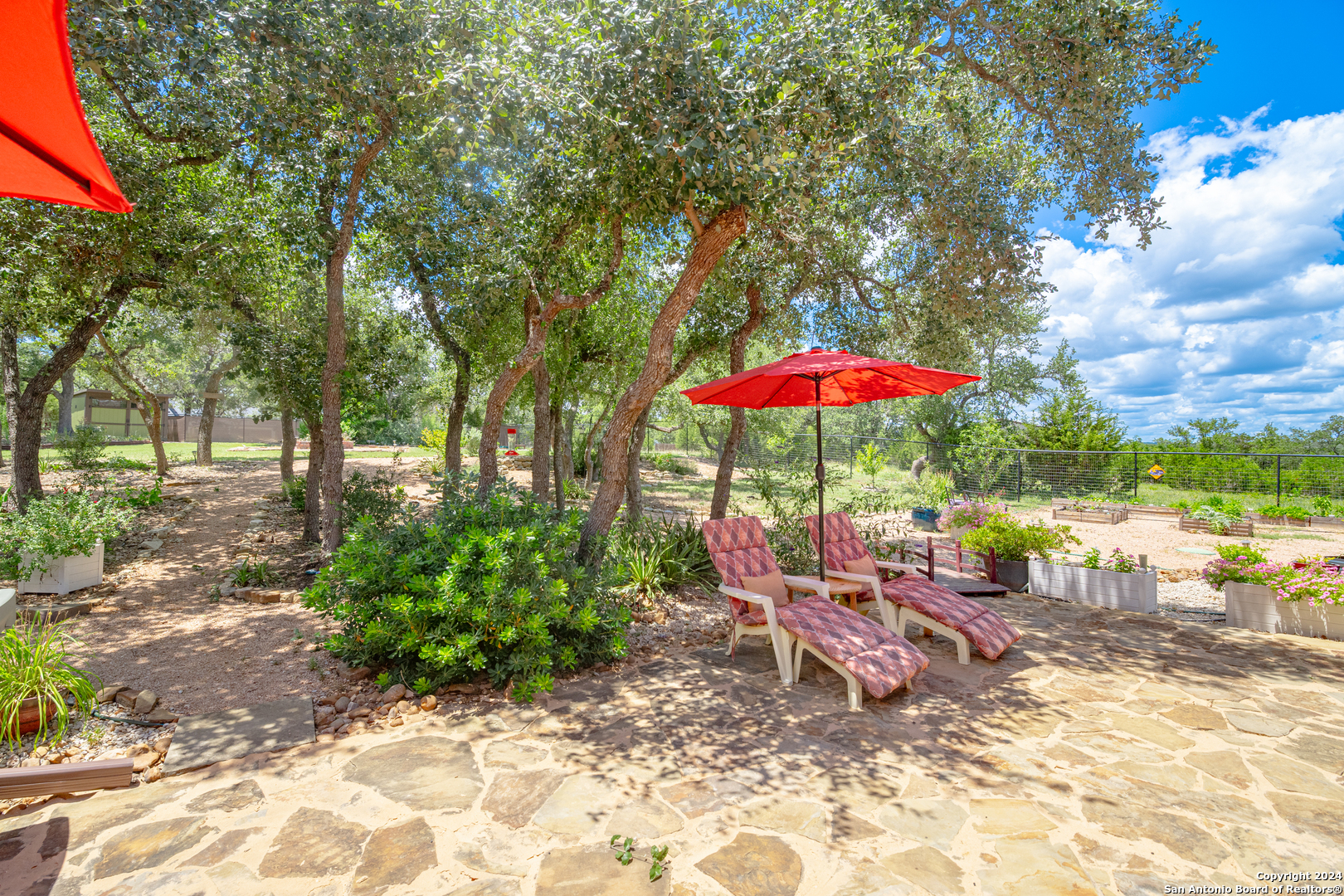 924 Rhinestone Canyon Lake, TX 78133 - Photo 28 of 41 a chair and tables in the patio
