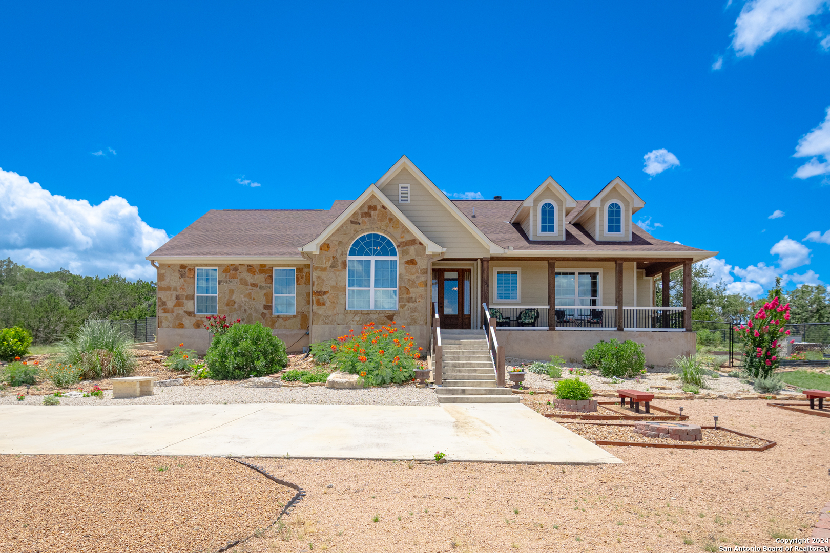 924 Rhinestone Canyon Lake, TX 78133 - Photo 3 of 41 a front view of a house with a yard
