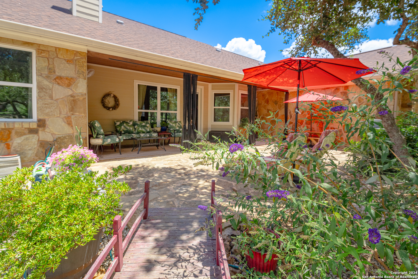 924 Rhinestone Canyon Lake, TX 78133 - Photo 31 of 41 a view of a house with yard and sitting area