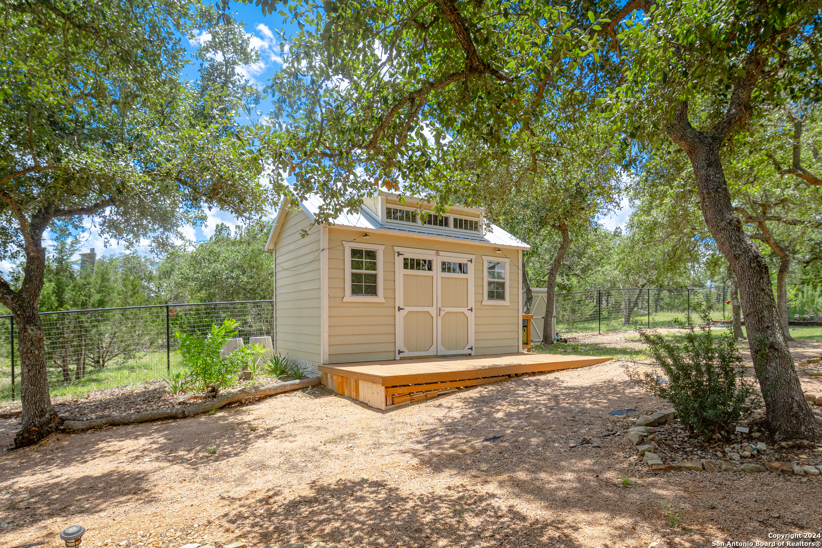924 Rhinestone Canyon Lake, TX 78133 - Photo 34 of 41 a front view of a house with a yard