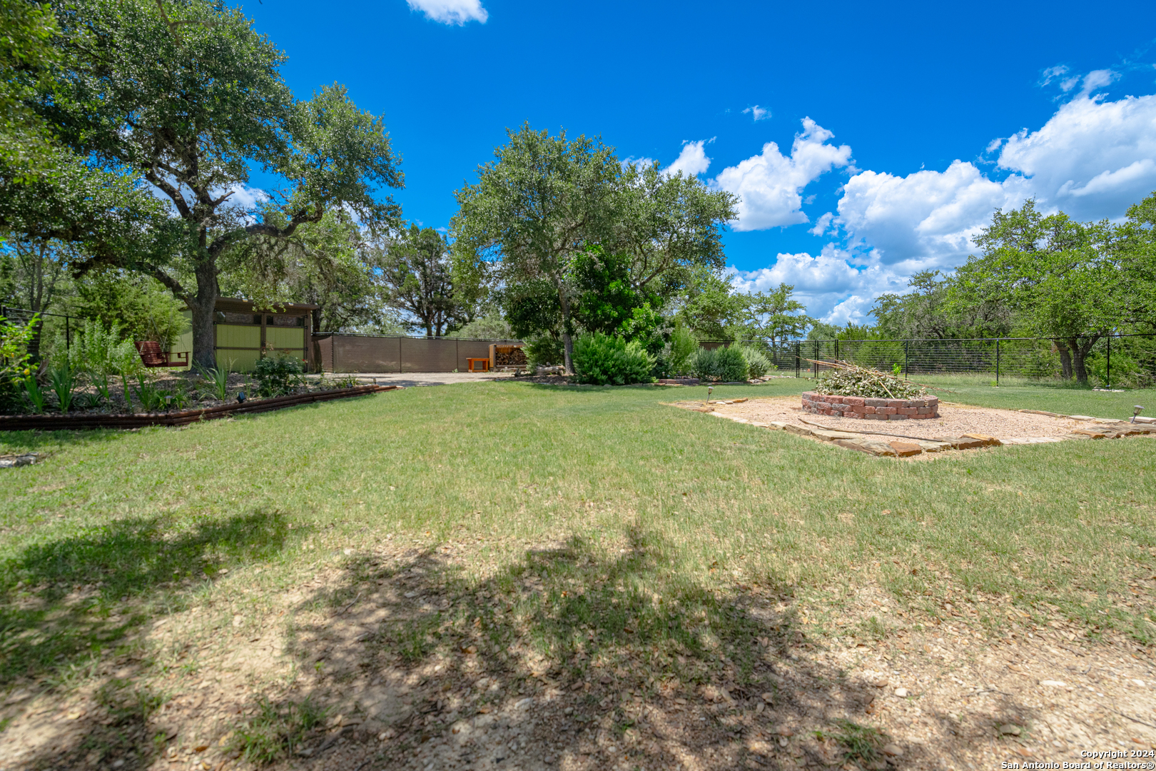 924 Rhinestone Canyon Lake, TX 78133 - Photo 37 of 41 a view of a backyard of the house
