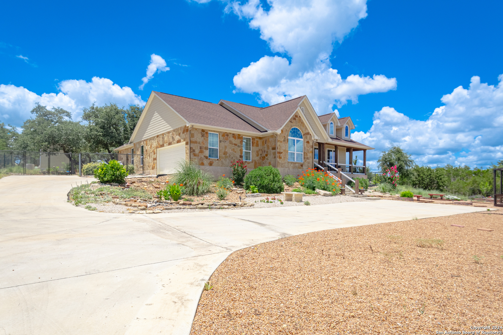 924 Rhinestone Canyon Lake, TX 78133 - Photo 4 of 41 a view of a house with a yard and potted plants