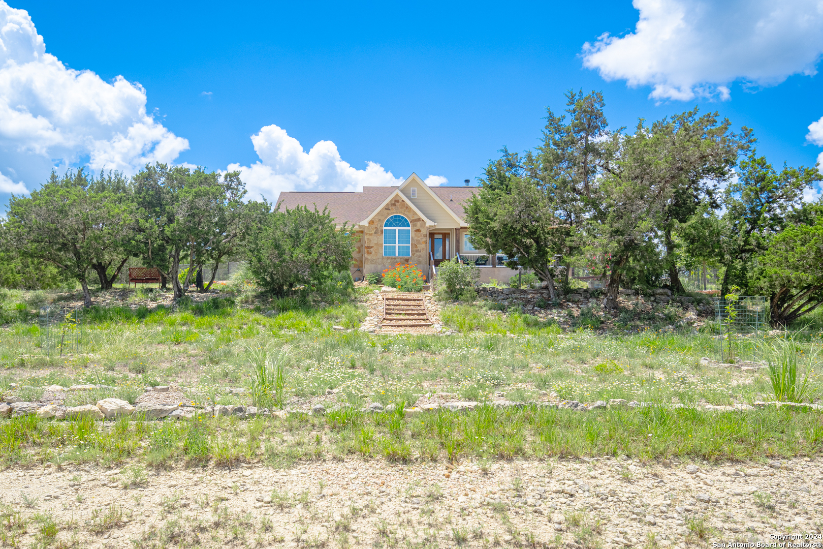 924 Rhinestone Canyon Lake, TX 78133 - Photo 41 of 41 a front view of a house with a yard