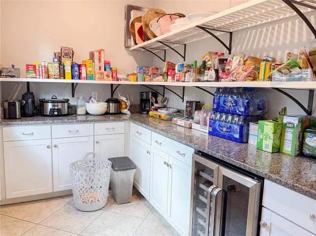 a kitchen with lots of counter top space and wooden floor
