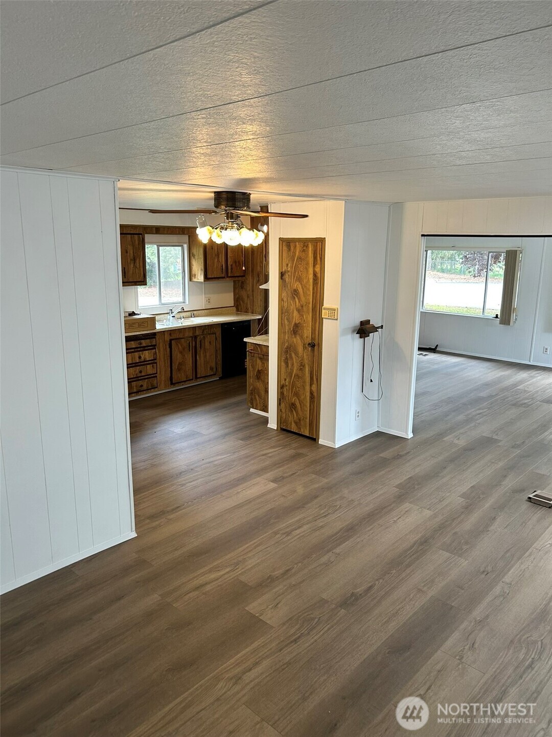 791 Elliot Court Sequim, WA 98382 - Photo 8 of 37 a view of a room wooden floor kitchen view and windows
