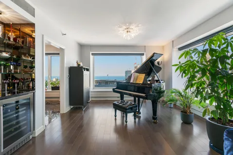 a workspace with furniture window and wooden floor